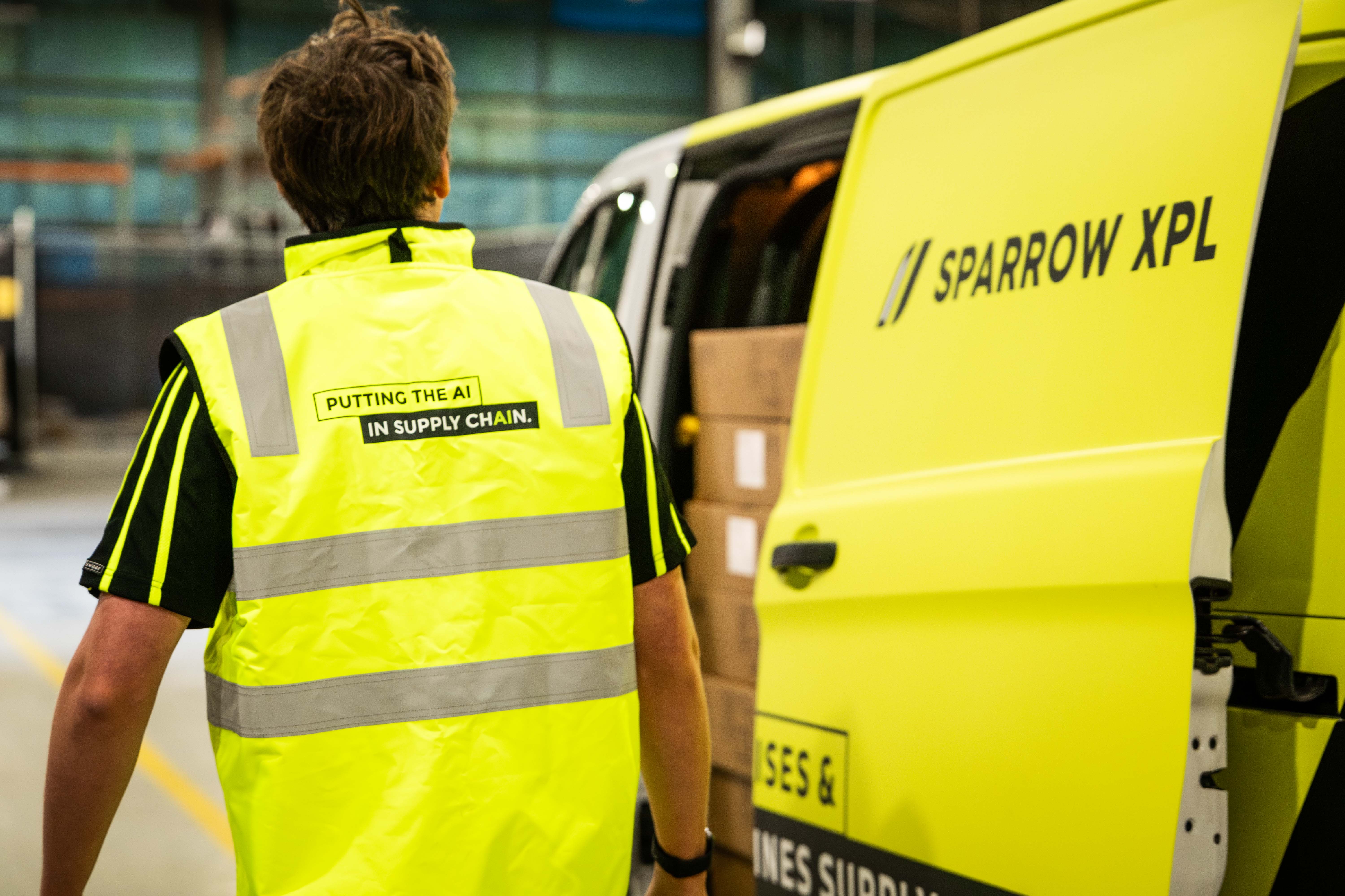 Sparrow XPL team member loading freight into branded delivery van